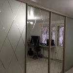 sliding wardrobe with facet mirror interior photo