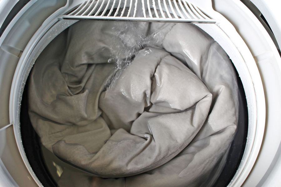 washing blankets in a washing machine photo