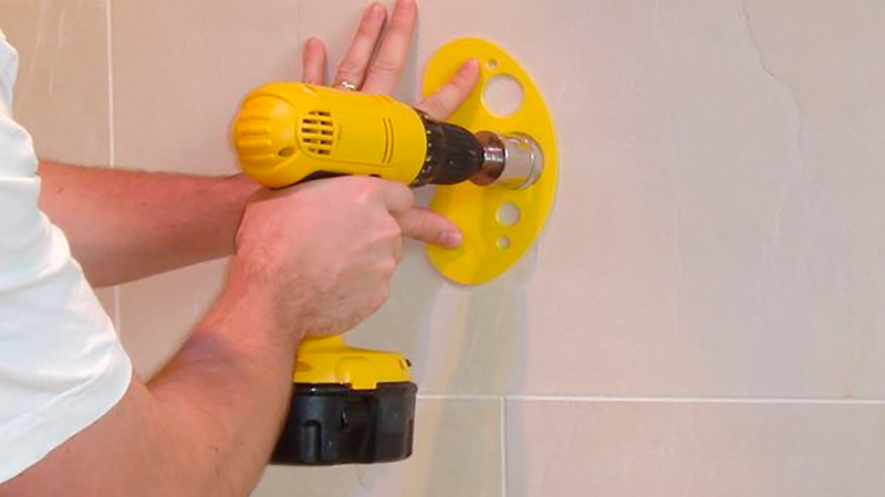 drilling tiles on the wall