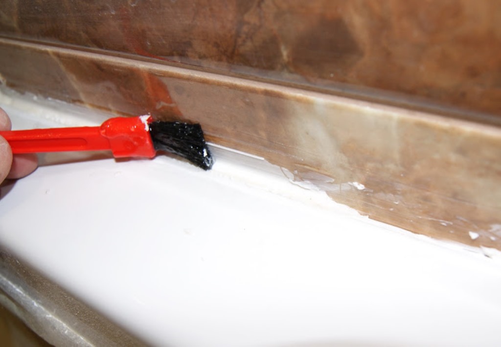 removing silicone from tiles