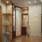 corner wardrobe in the hallway with a yellow umbrella