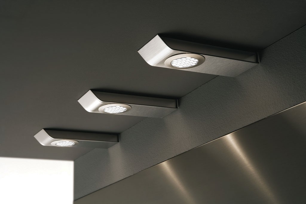 Surface mounted luminaires for cabinets