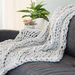 white knitted blanket on the sofa