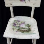 decoupage of a chair white with a village