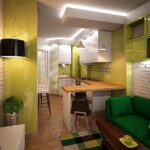 green sofa in yellow kitchen