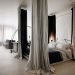 bed in the bedroom with a canopy