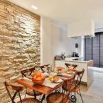 wall near the table in the kitchen design photo