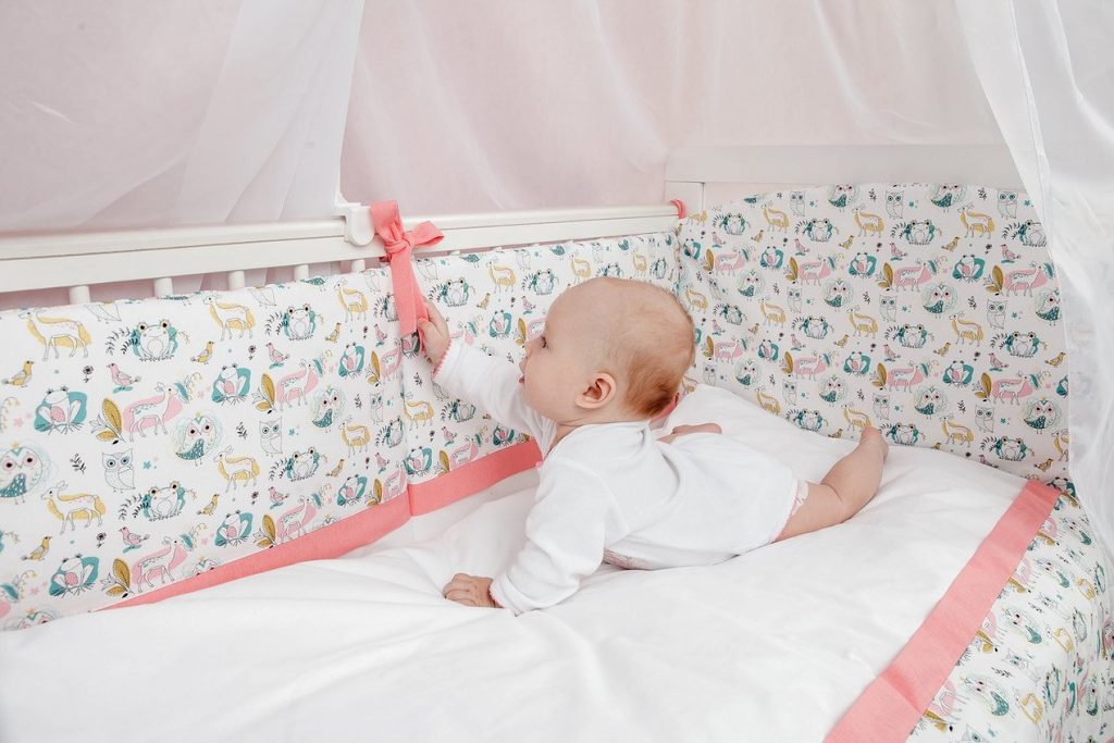 bright colors and beautiful design of the side for a baby cot