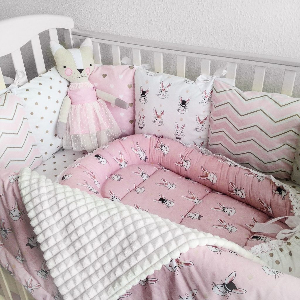 side-pillows in the baby's crib