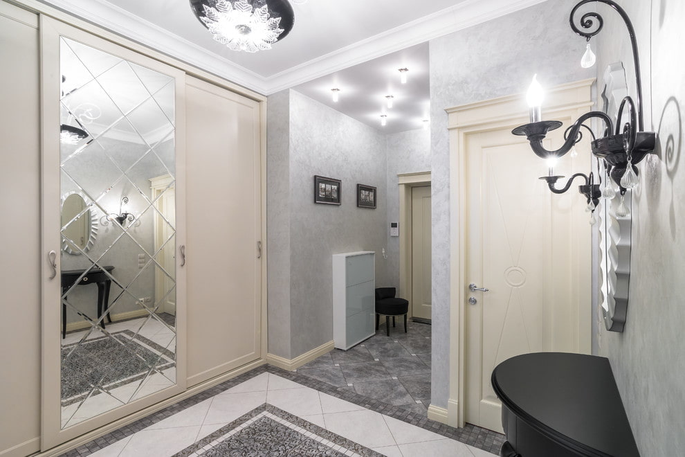 sliding wardrobe with faceted mirror in the hallway