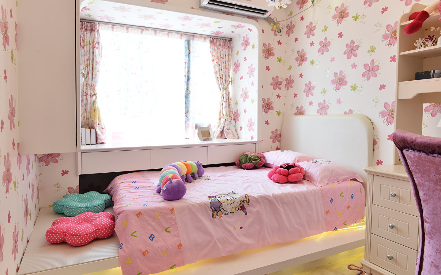 bed by the window in the nursery