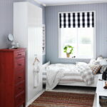 bed by the window in the bedroom decor photo