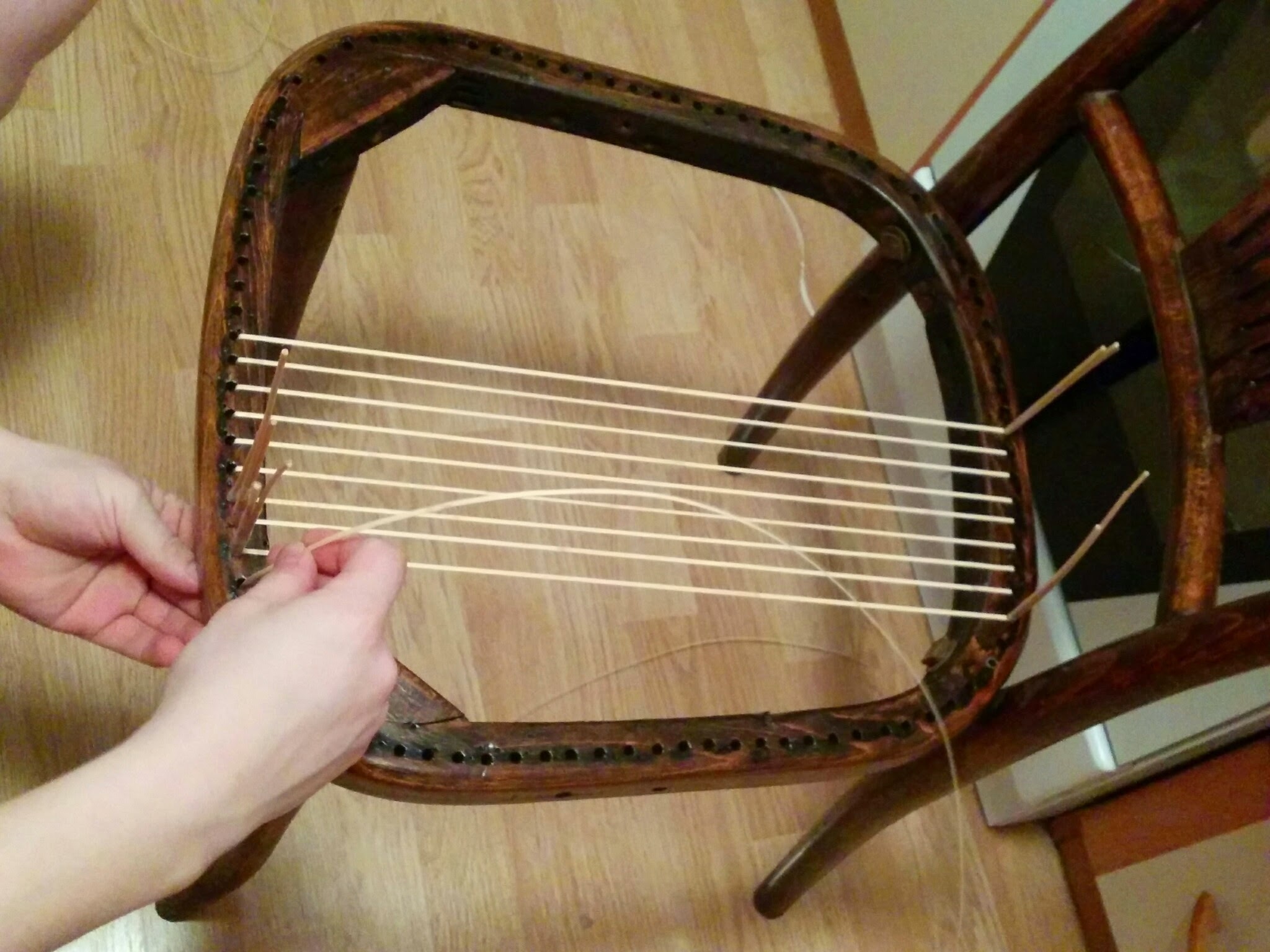 weaving a chair from a vine