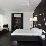 dark bed with white walls