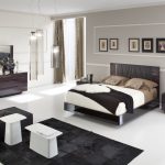 gray walls and dark furniture in the bedroom