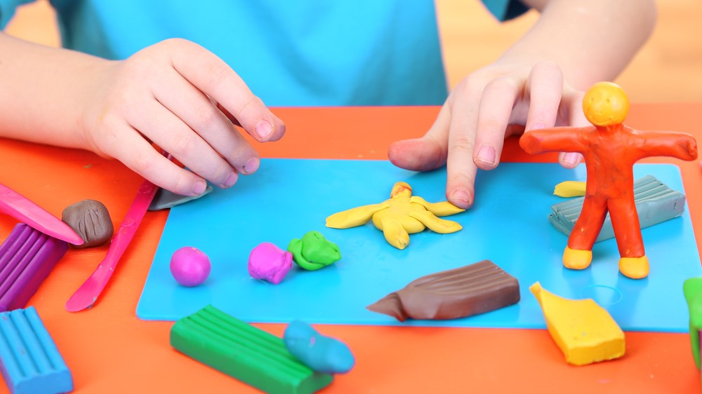 child and plasticine