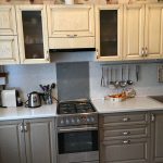 gray kitchen with beige cabinets