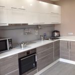 gray kitchen with white cabinets