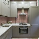 gray kitchen with red tiles