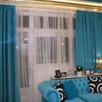 blue sofa with curtains