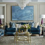 blue sofa with large chandelier