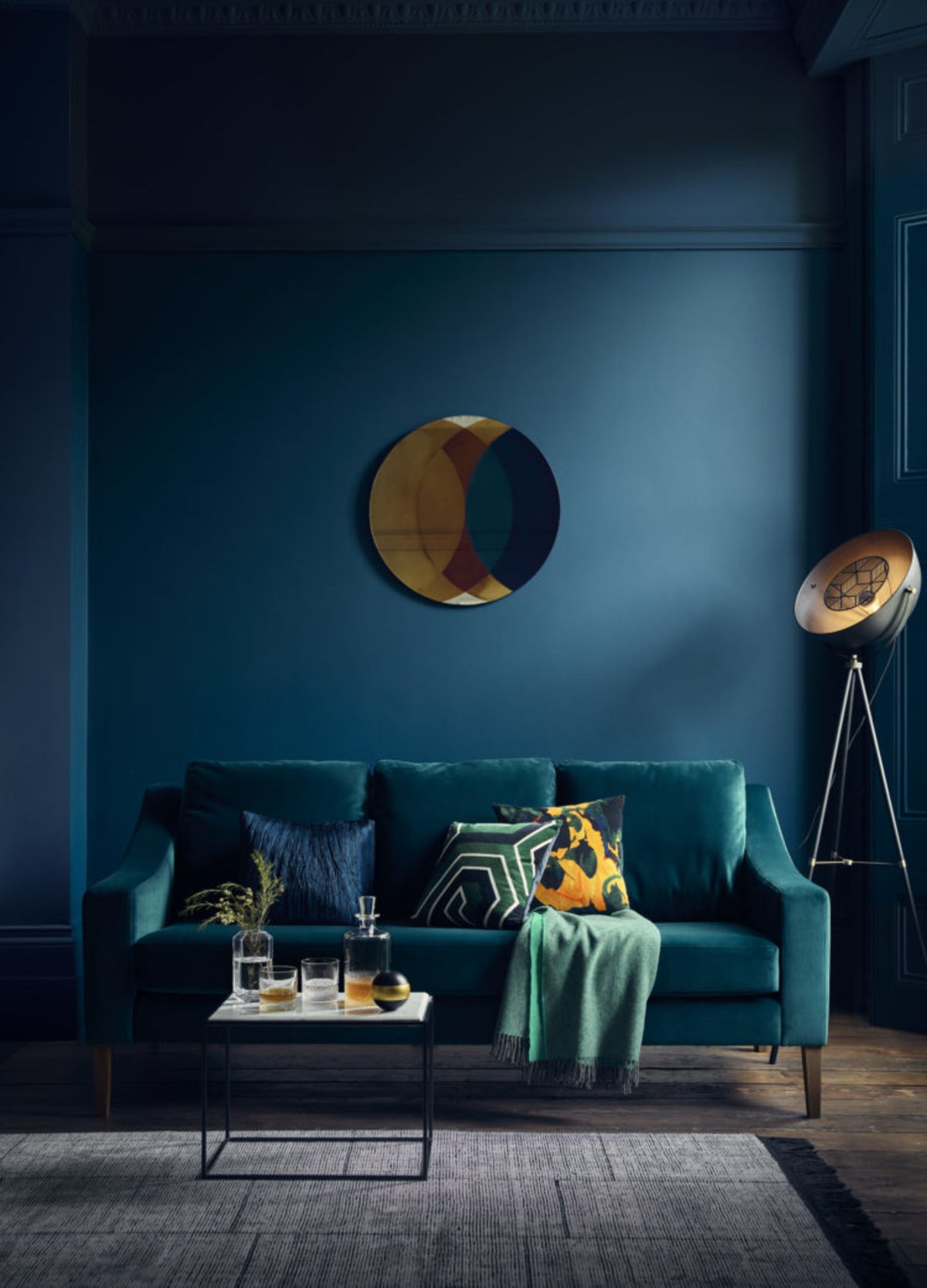 blue sofa in a dark room