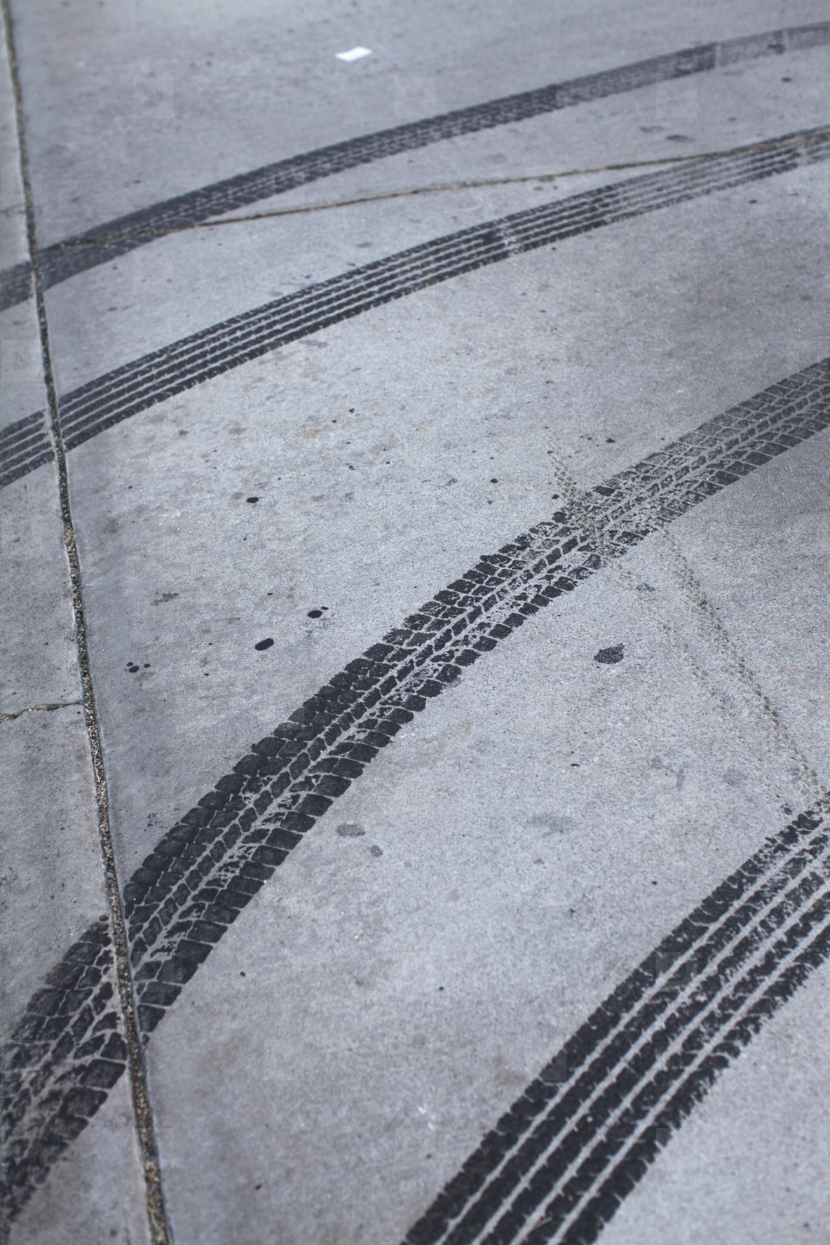 bicycle tire marks on linoleum