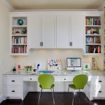 table along the window in the nursery with green chairs