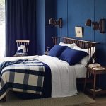 dark blue walls in the bedroom with dark furniture