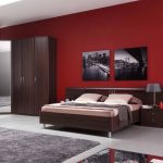 dark furniture with red wallpaper