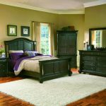 dark green furniture in the bedroom