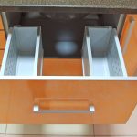 orange sink cabinet with drawer