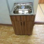 brown wooden sink cabinet