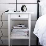 bedside table with alarm clock