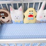 pillow toys in the bed of a newborn