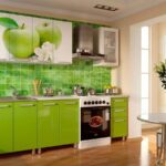 green kitchen with two apples