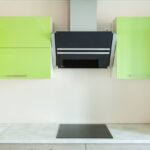 green kitchen with tiles