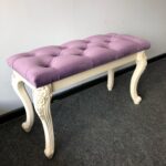 upholstered bench with purple decor