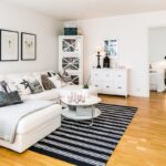 white furniture with striped carpet