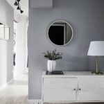 white furniture with round mirror