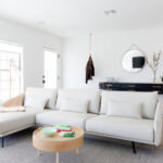 white leather sofa with round table