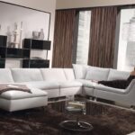 white leather sofa with brown curtains