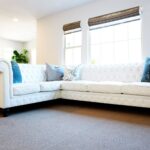 white leather sofa with cushions