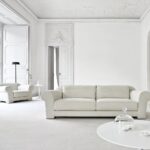 white leather sofa in a white room