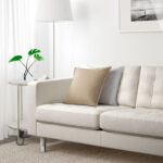 white leather sofa with plant