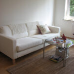 white leather sofa with carpet