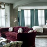 turquoise curtains with burgundy sofa