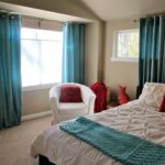 turquoise curtains in a bright bedroom