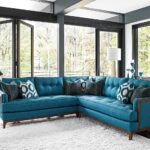 turquoise sofa with cushions