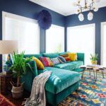 turquoise sofa with colorful pillows